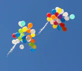 Balloons rising into the sky