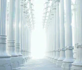 Two long rows of white stone columns